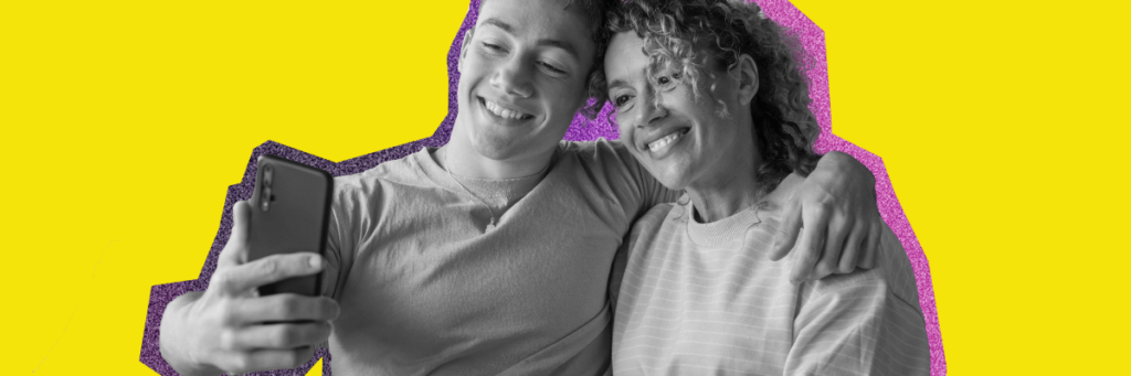 mom and son smiling as they take a selfie together