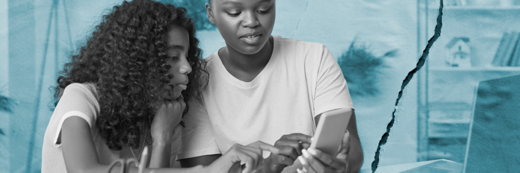 mom and daughter looking at cell phone together