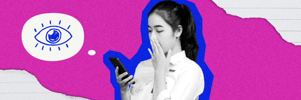 girl covers her mouth looking at her phone