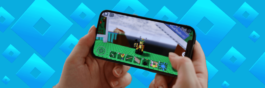 hands playing roblox on cellphone