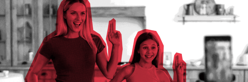 influencer mother and daughter doing a dance in front of a smart phone