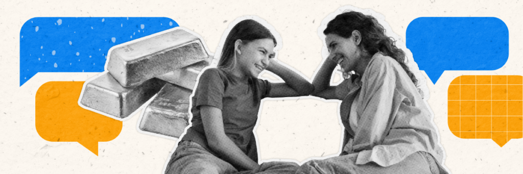 mom and daughter smiling at each other in front of gold bricks