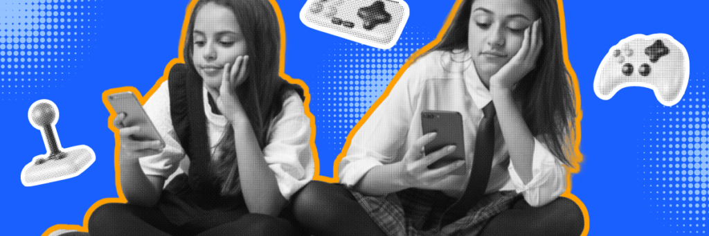 two young girls playing games on their phones with gaming controllers in the background