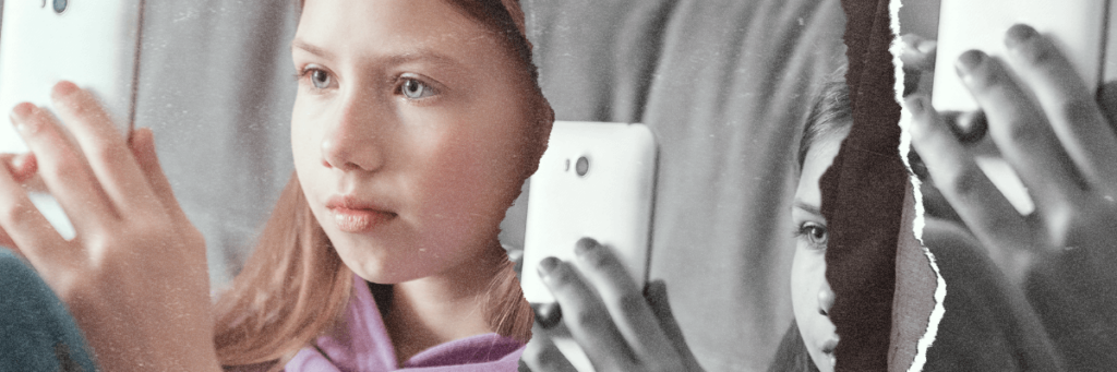 young girl looking at cell phone