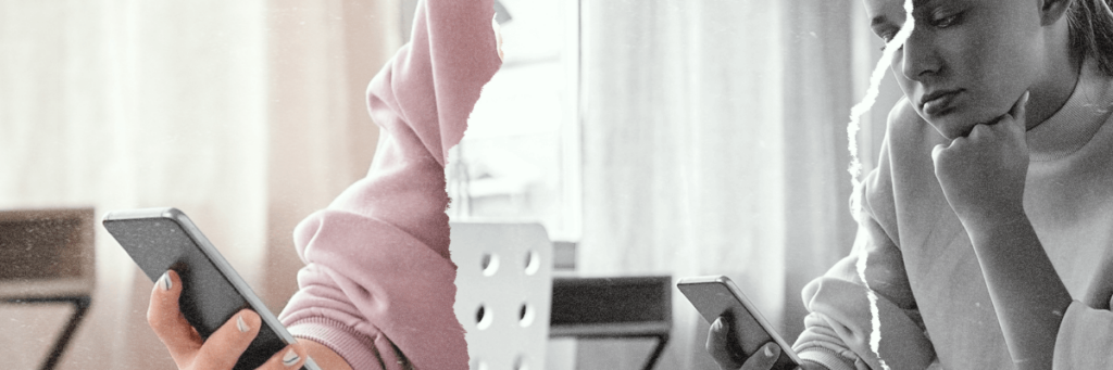 sad dejected teen girl stares sadly at her phone with her fist under her chin