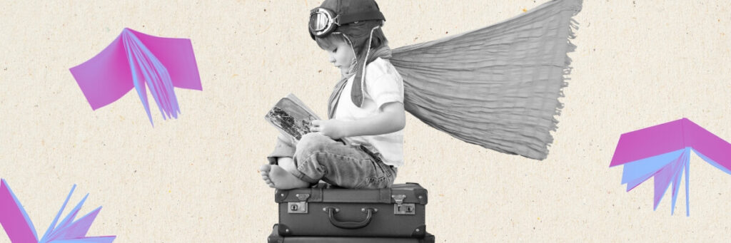 little boy sitting on suitcase