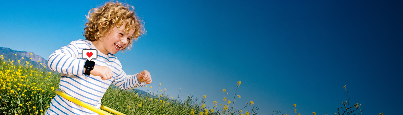 A joyful kid playing with a hula hoop in a sunny wildflower field